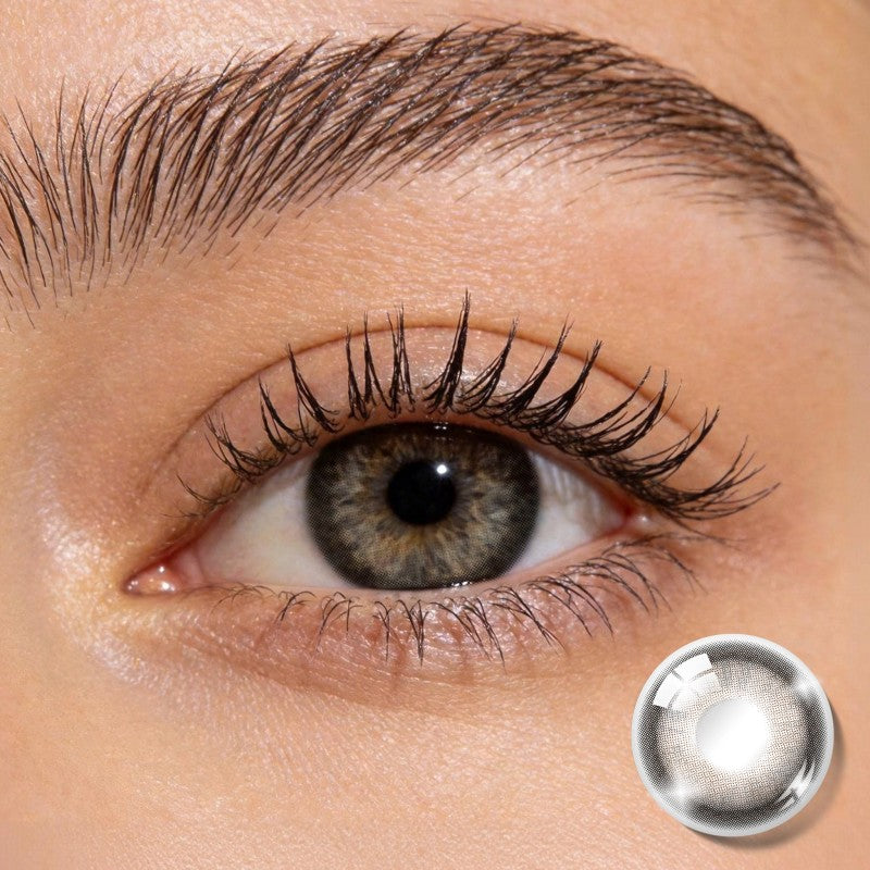 Close-up shot of an eye wearing MIIEMO Warm Hazel Brown colored contact lens showing defined lens pattern