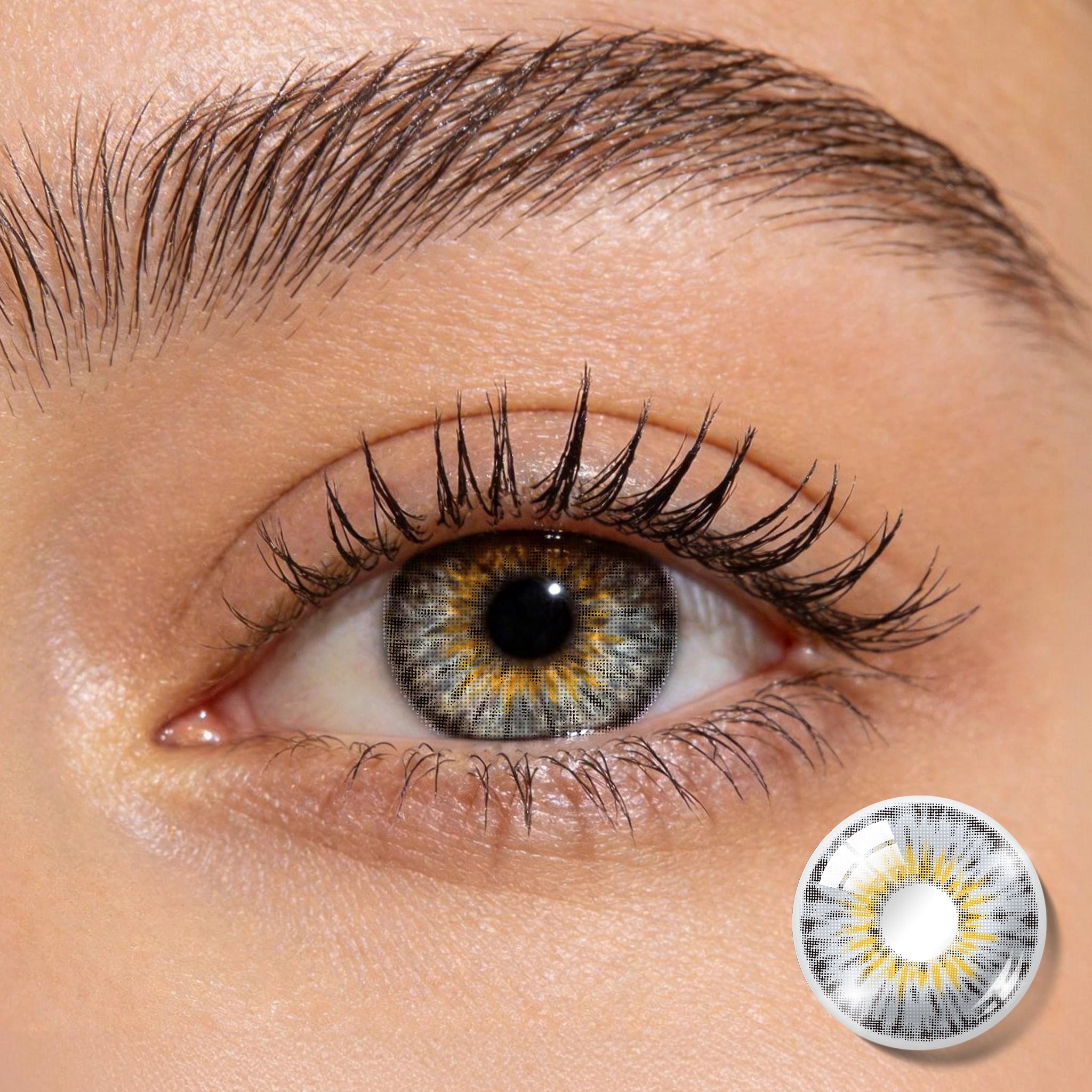 Close-up shot of an eye wearing MIIEMO Amber Haze Cool Gray contact lens showing high color payoff on dark eyes