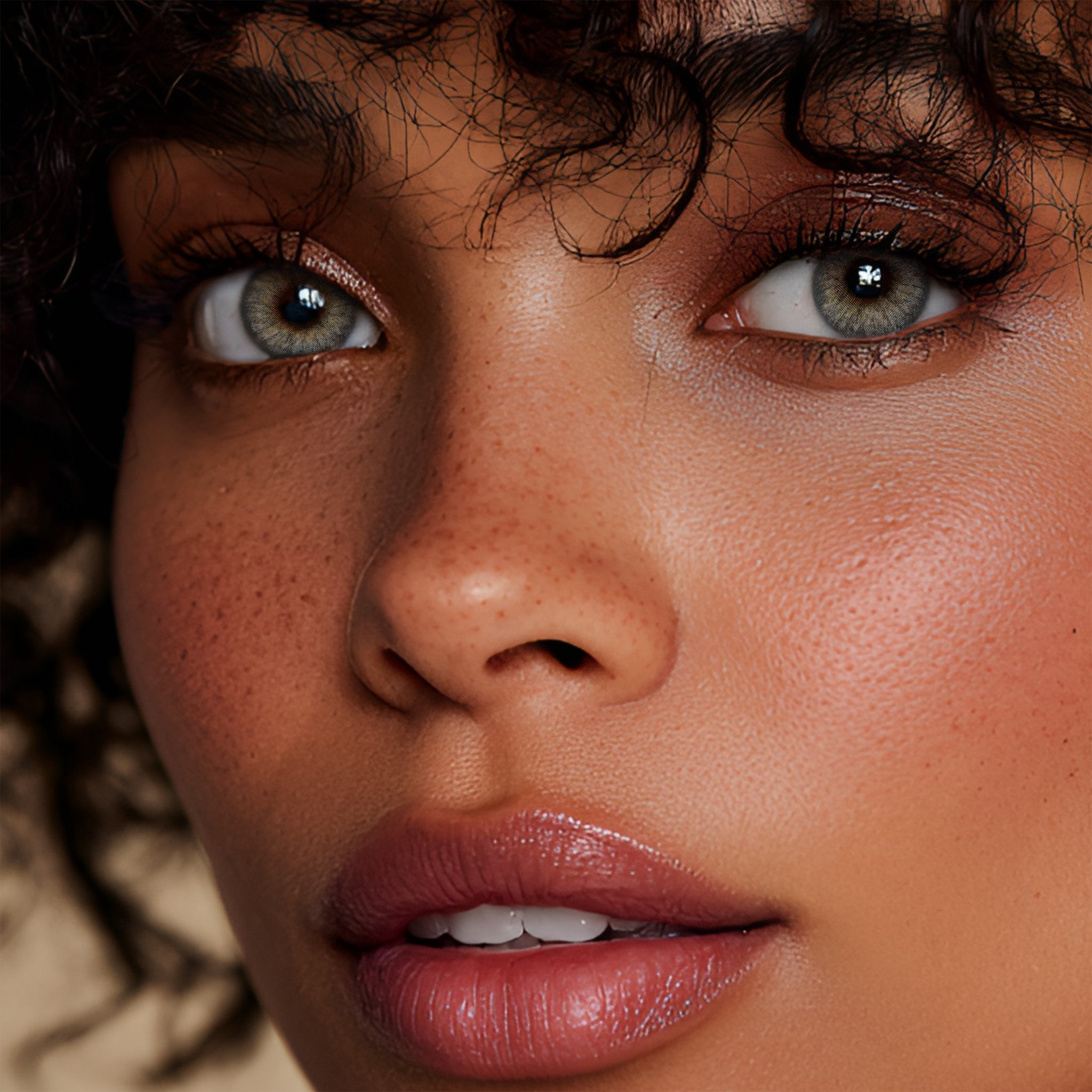 Stunning black female model with gorgeous warm makeup wearing MIIEMO Olive Green Gold Feather gold accent contact lenses