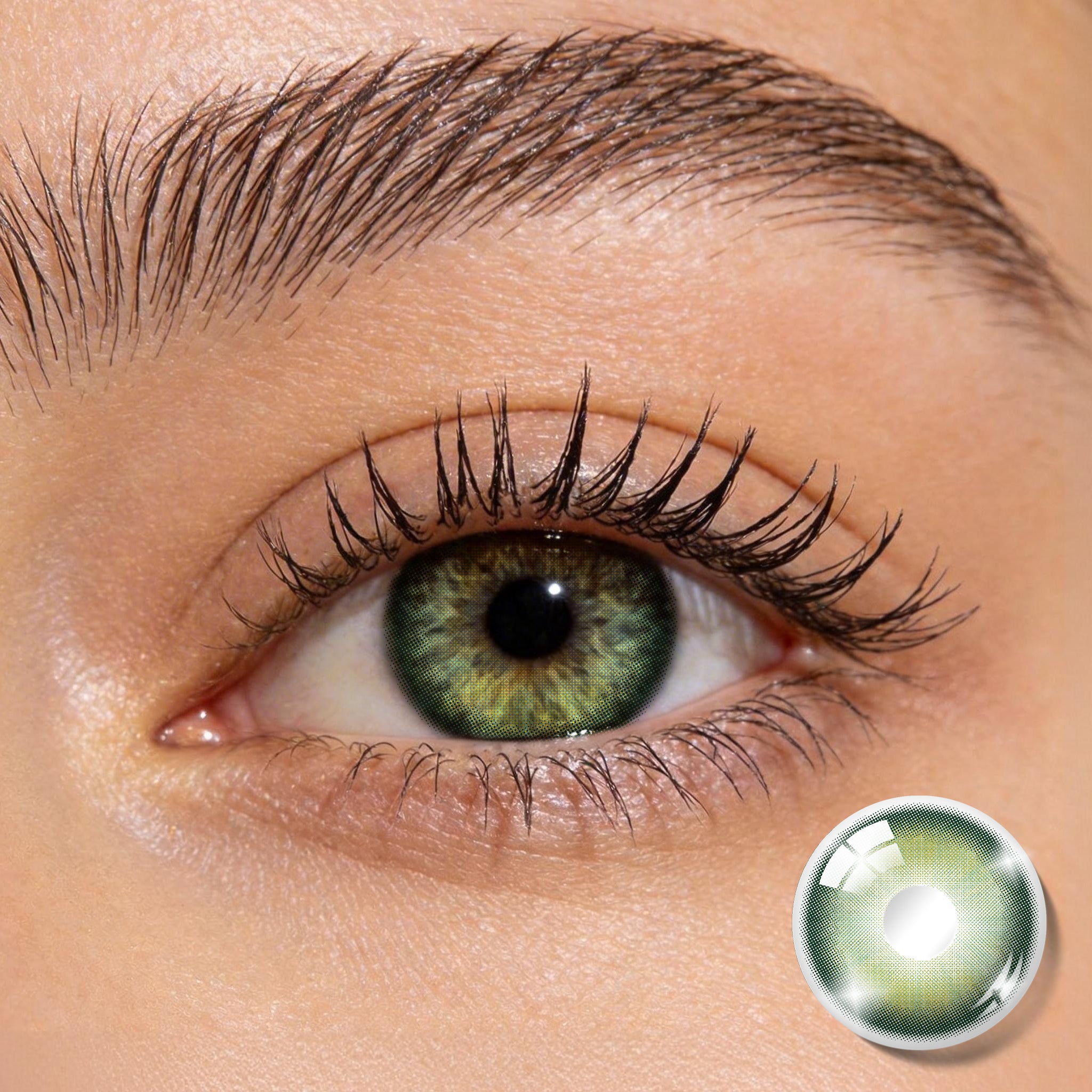 Close-up shot of an eye wearing MIIEMO Forest Aura Green colored contact lens showing natural olive green tones