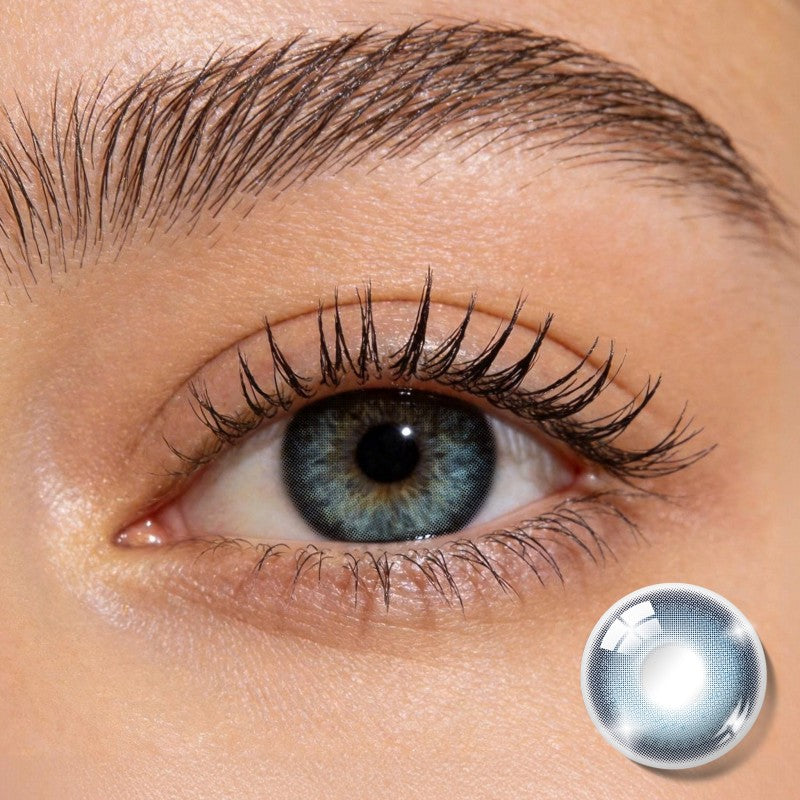 Close-up shot of an eye wearing MIIEMO Ocean Mist Blue colored contact lens showing soft ocean inspired blue tone
